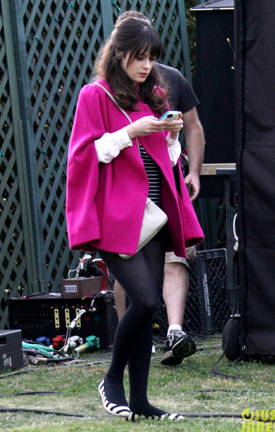 Zooey Deschanel rocks a bright pink coat on the set of New Girl on Tuesday (January 22) in West Hollywood, Calif.