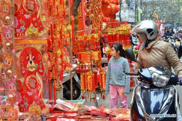 Hình ảnh không khí Tết rộn ràng khắp phố phường Hà Nội tràn ngập các trang báo Trung Quốc - ảnh 7 Hình ảnh không khí Tết rộn ràng khắp phố phường Hà Nội tràn ngập các trang báo Trung Quốc - Ảnh 7.