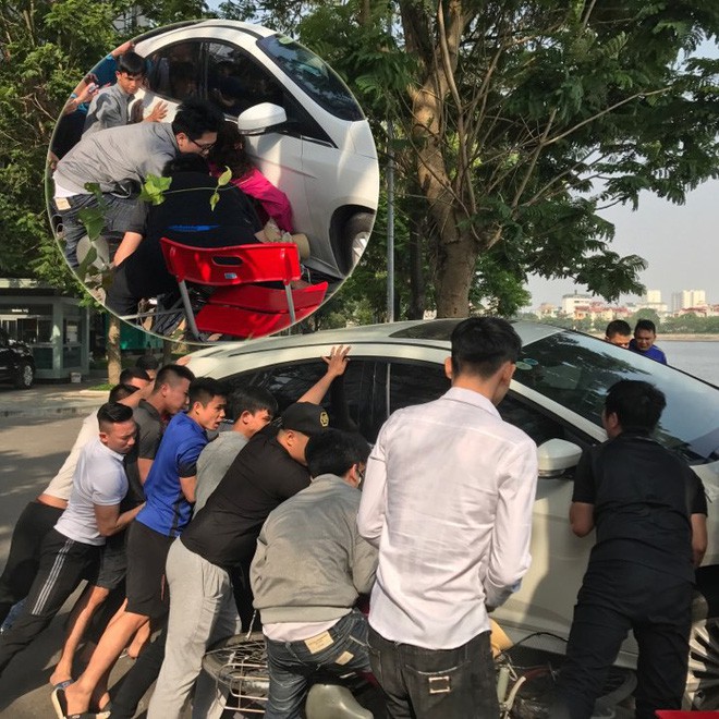 Hà Nội: Hàng chục thanh niên khiêng xe giải cứu người phụ nữ bị mắc kẹt sau cú mất lái lao lên vỉa hè - Ảnh 10.