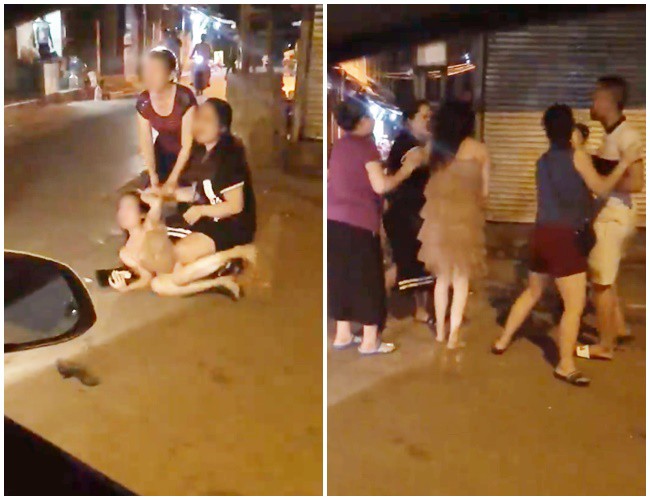 Xôn xao clip cô gái trẻ bị túm tóc đánh ghen ngay trên phố Hà Nội - Ảnh 1.