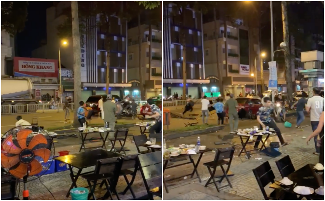 Clip: Nhóm thanh niên cầm bàn ghế của quán nhậu phang nhau ngay giữa đường phố Sài Gòn khiến nhiều người hoảng sợ - Ảnh 2.